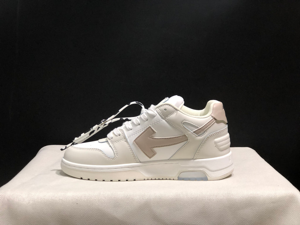 Outer side profile of a white low-top sneaker showing the arrow graphic, layered panels, and translucent outsole inserts.