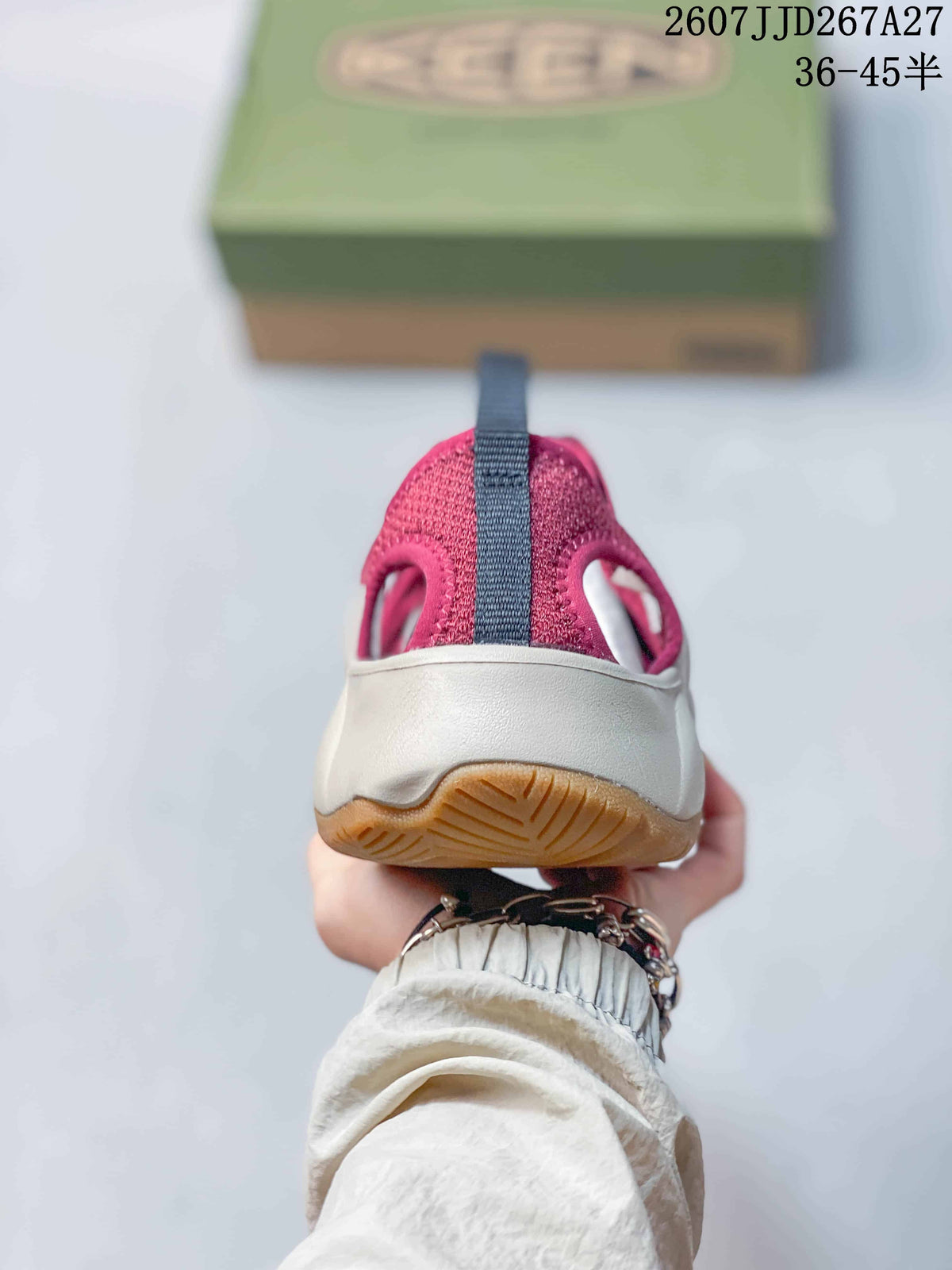 Rear view of a burgundy KEEN sandal showing the heel opening, rear pull tab, light midsole, and outsole.