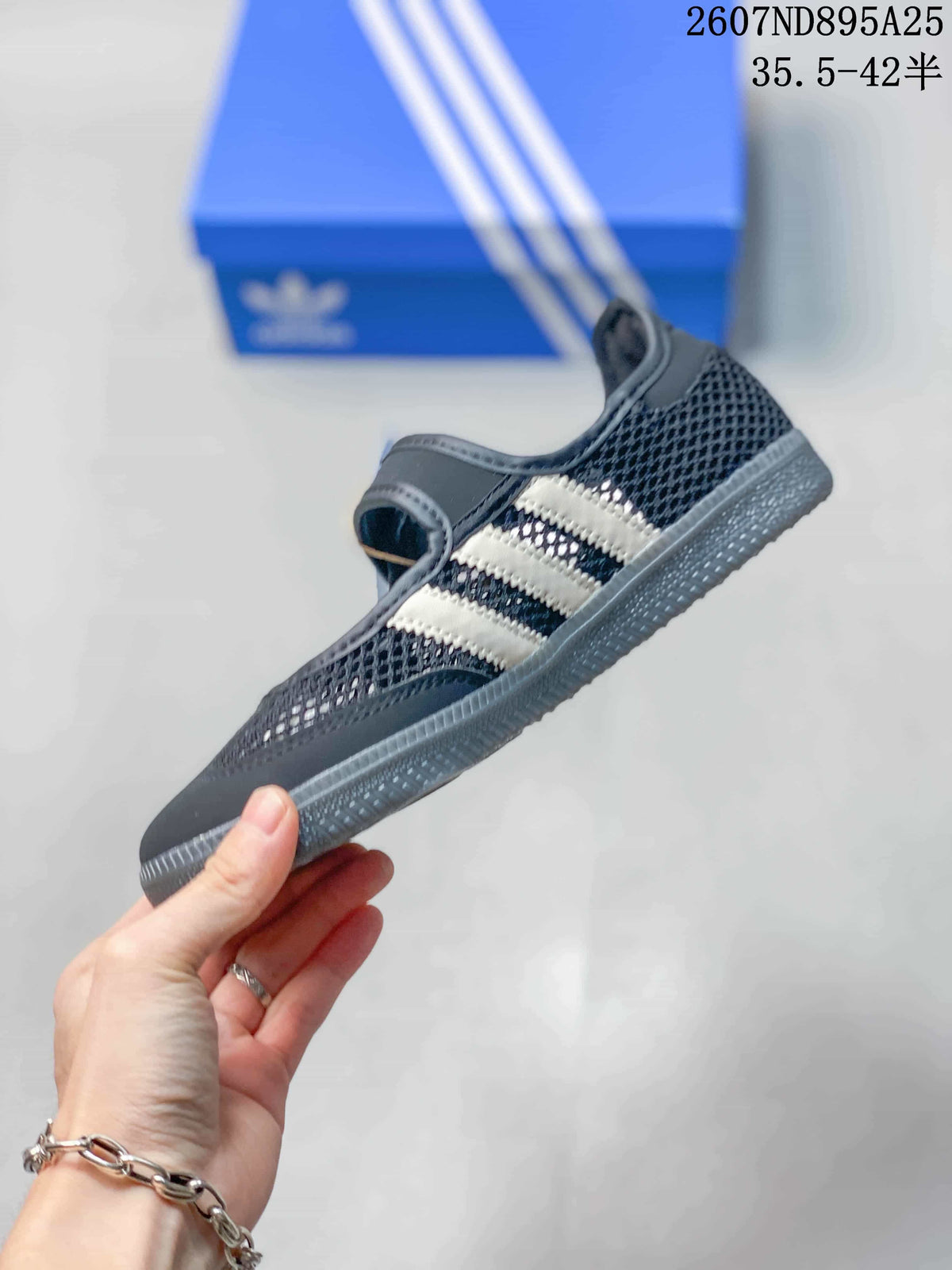 Side profile showing the low-top silhouette, mesh upper, light three-stripe detailing, and textured sole.