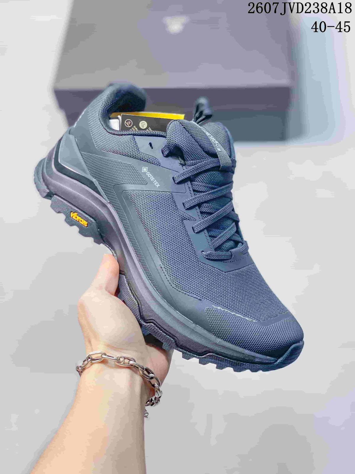 Angled side view of the dark gray KAILAS hiking shoe showing visible Gore-Tex and Vibram branding.