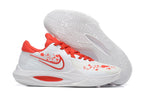 White basketball shoe with bright red accents and red decorative graphics.