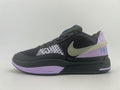Side view of a dark Nike basketball shoe with a mesh upper, patterned overlays, lavender accents, and a contrasting Swoosh.