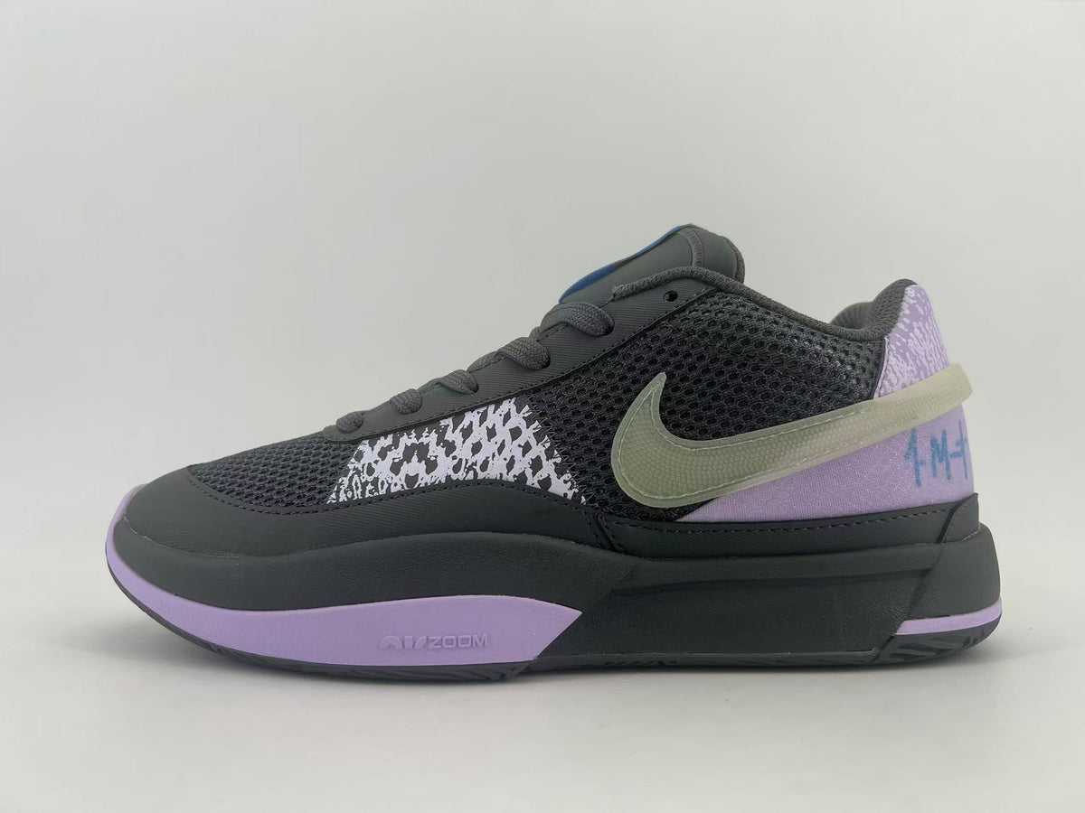 Side view of a dark Nike basketball shoe with a mesh upper, patterned overlays, lavender accents, and a contrasting Swoosh.