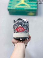 Rear view showing the patterned heel panel, red embroidered winged basketball logo, and white midsole.