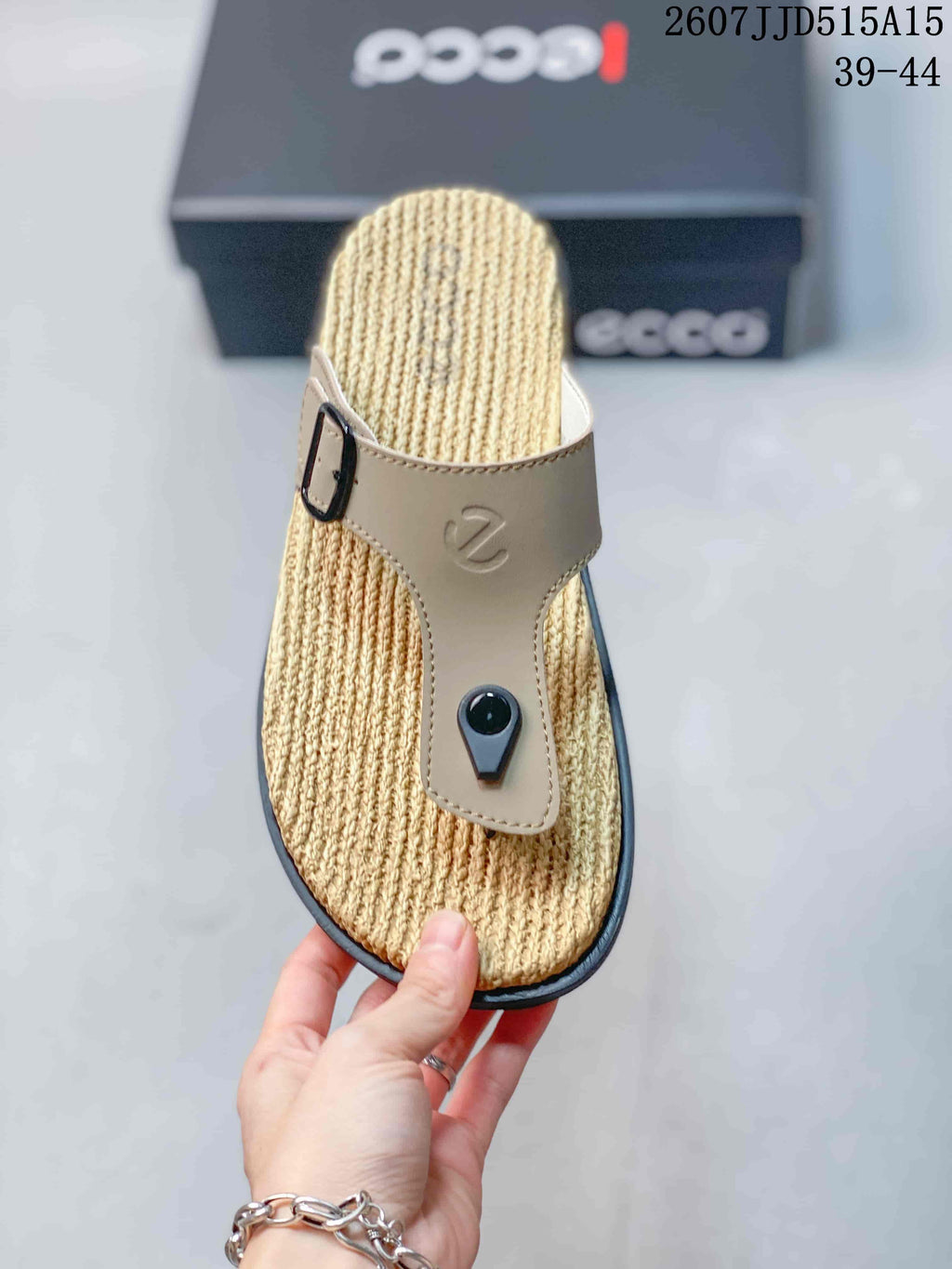 Top view showing the beige adjustable buckle strap and textured sandal footbed.