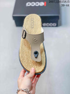 Top view showing the beige adjustable buckle strap and textured sandal footbed.