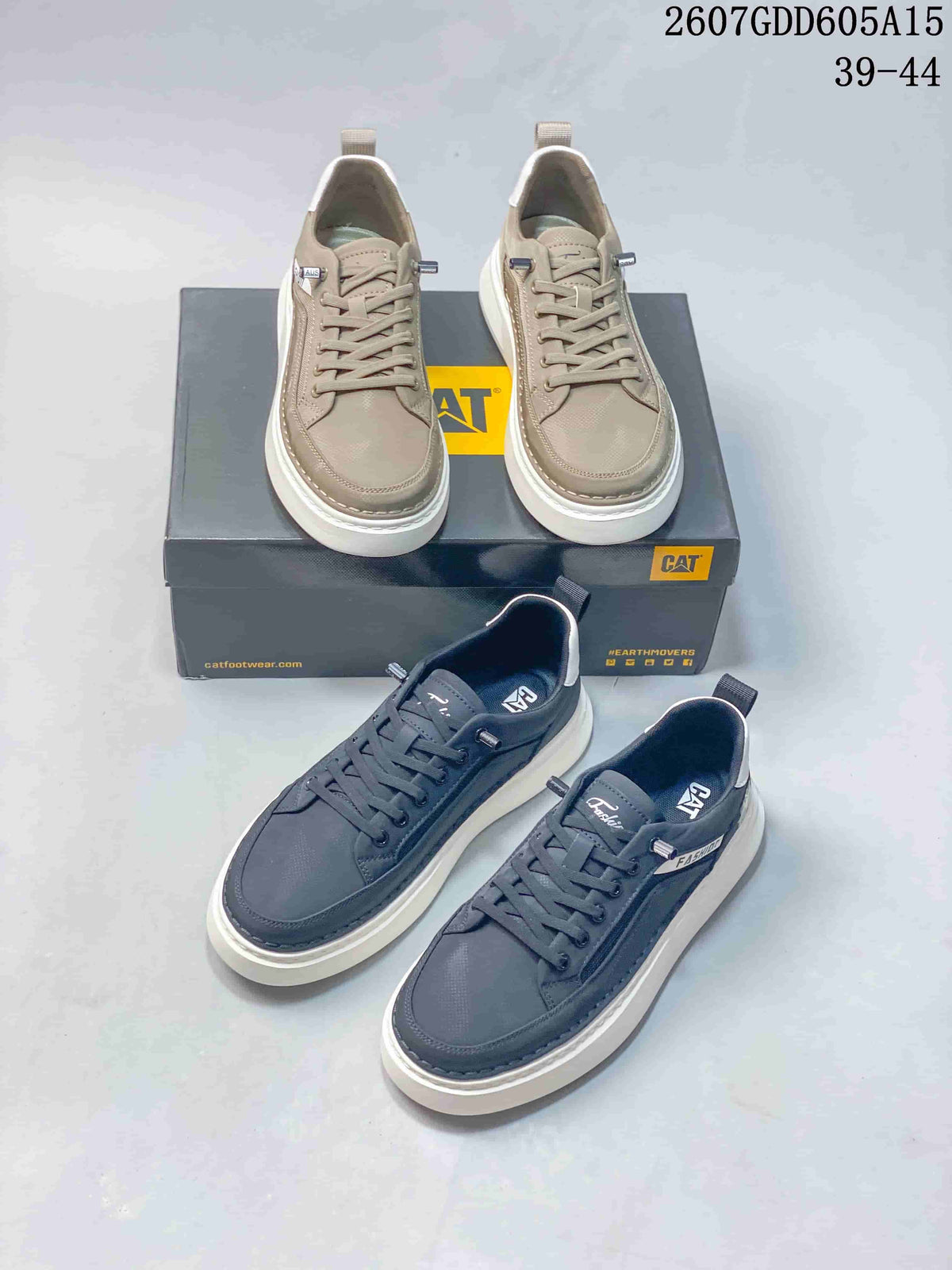 Taupe and charcoal CAT sneakers shown together with branded boxes and low-profile lace-up construction.