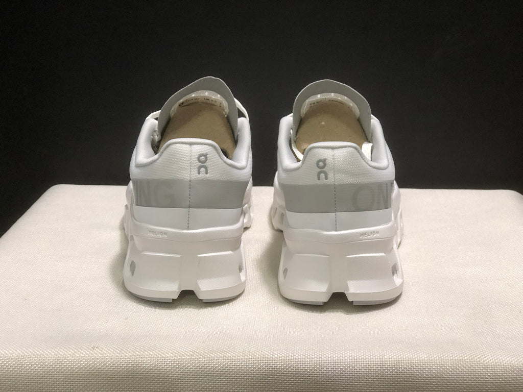 Rear view showing the padded collars, heel branding, and white sole structure.