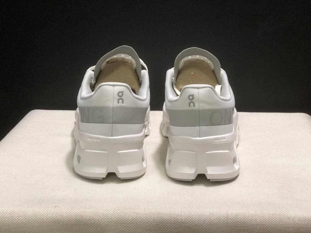 Rear view showing the padded collars, heel branding, and white sole structure.