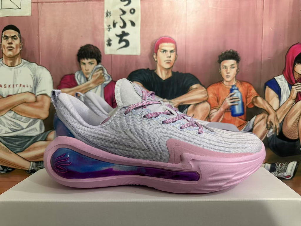 Side view of a gray and pink Kyrie basketball shoe with a blue-purple side detail.