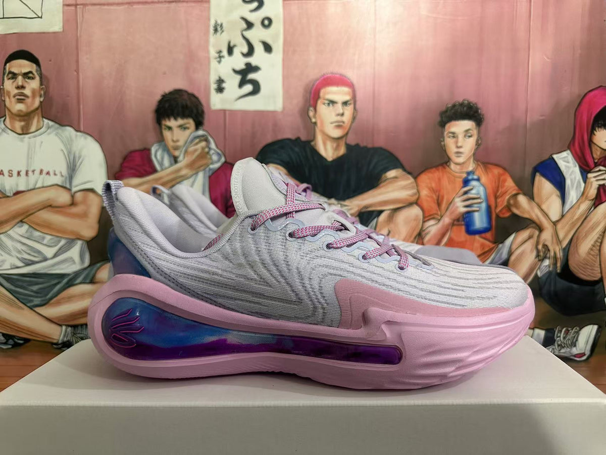 Side view of a gray and pink Kyrie basketball shoe with a blue-purple side detail.