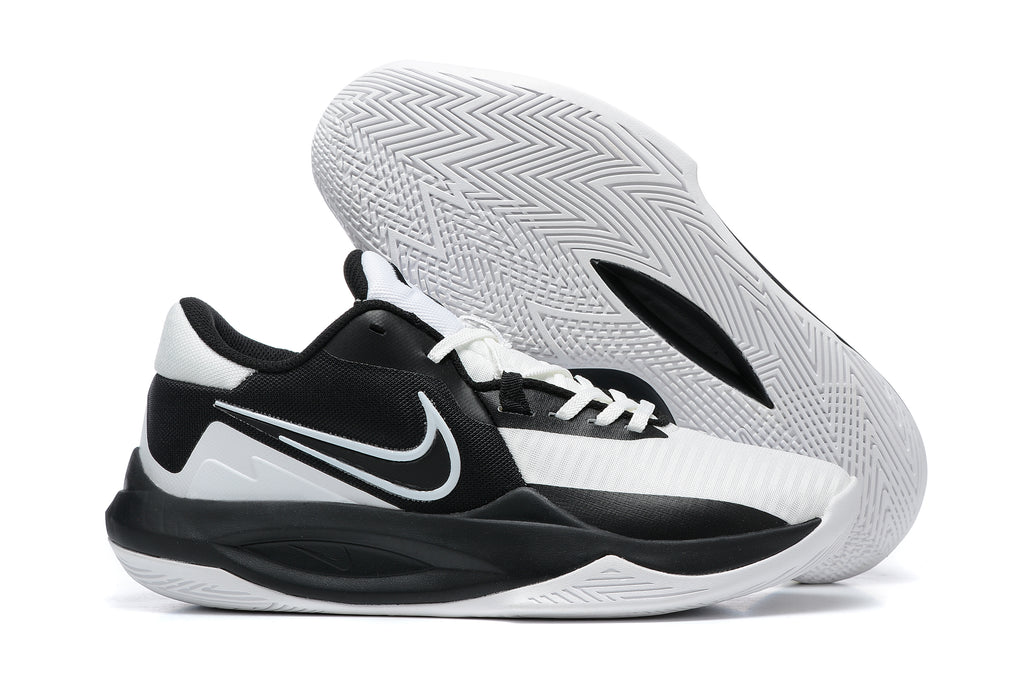Black and white low-top basketball shoe with a patterned white outsole.