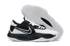Black and white low-top basketball shoe with a patterned white outsole.