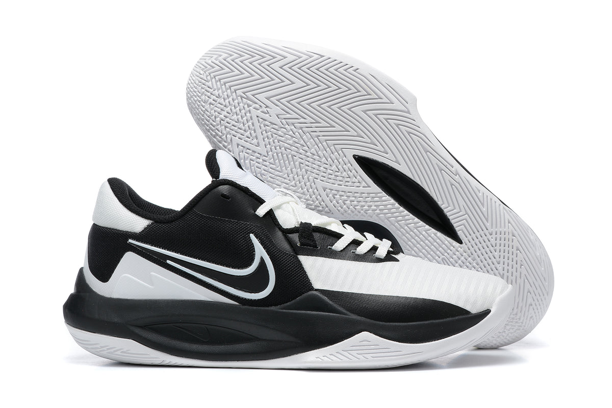 Black and white low-top basketball shoe with a patterned white outsole.