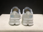 Rear view of the pair showing On branding, light blue heel graphics, and the structured white outsole.
