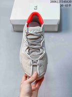 Top view showing the laces, layered panels and red collar