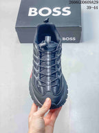 Front view of the gray sneaker showing its laces and central webbing detail.