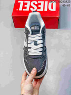 Top view showing the charcoal upper, white laces, and branded tongue
