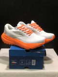 White and orange Brooks Glycerin 21 sneakers displayed on a blue shoe box, with the box label visible.