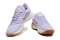Pair of lavender Nike Precision 7 basketball shoes with gum-colored outsoles, shown from the front.