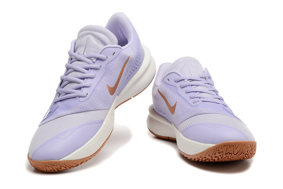 Pair of lavender Nike Precision 7 basketball shoes with gum-colored outsoles, shown from the front.