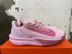 Side view showing the pink Nike Precision 7 shoe and patterned outsole