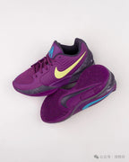 Purple Nike Ja 1 shoes shown from above and below, highlighting the outsole pattern