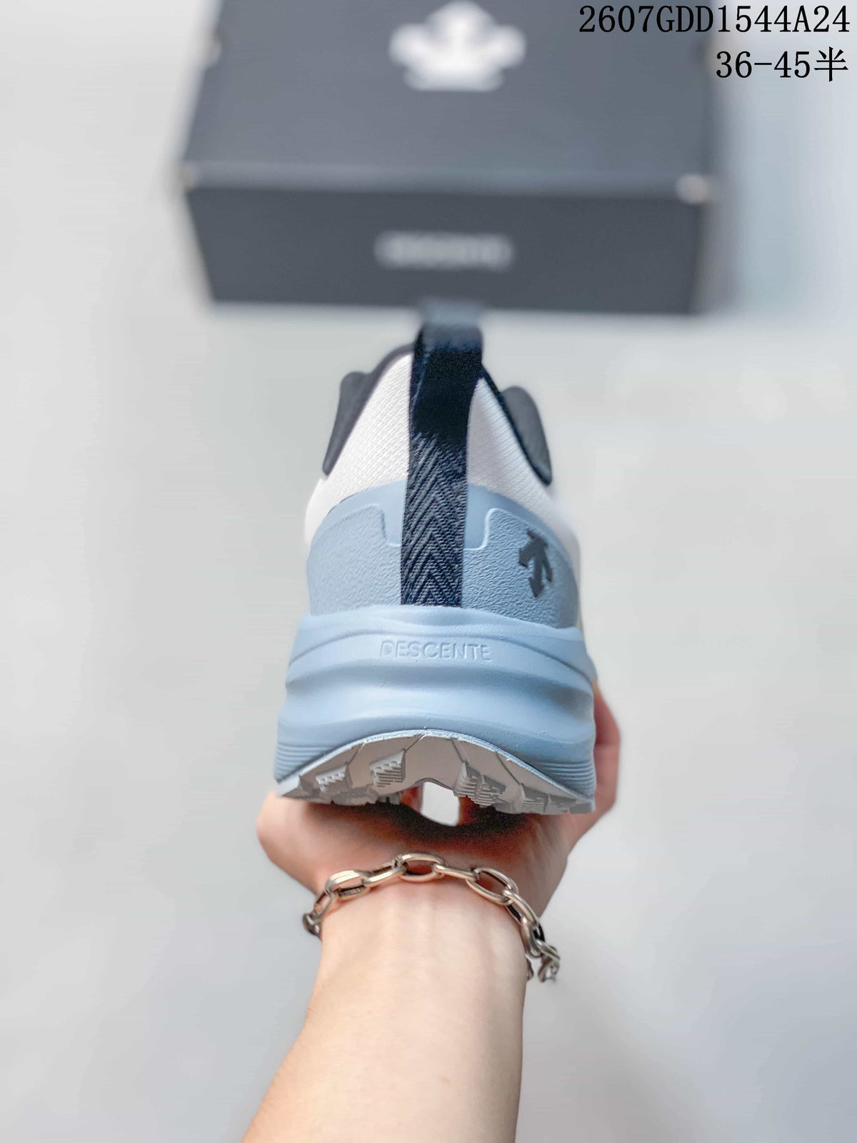Rear view showing the heel pull tab, DESCENTE branding, and layered light blue heel construction.