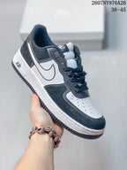 White, black and gray Nike Air Force 1 '07 LV8 sneaker with contrasting side panels.