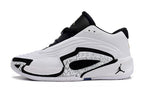 Side profile of a white Jordan Luka 3 shoe with black trim and a patterned panel