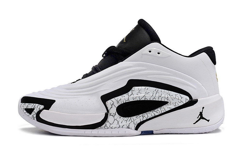 Side profile of a white Jordan Luka 3 shoe with black trim and a patterned panel