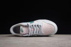 Top view showing the pale pink perforated toe, white laces and padded collar.