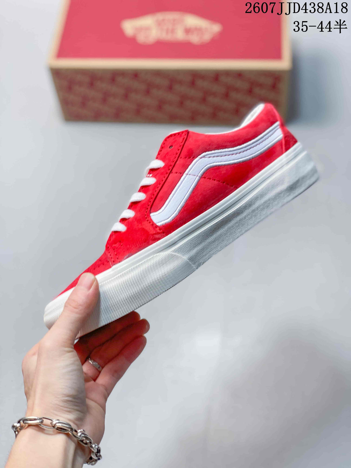 Side profile showing the red upper, white side stripe, and white rubber sole.