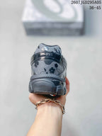 Rear view showing the padded heel and layered sole of the floral sneaker.
