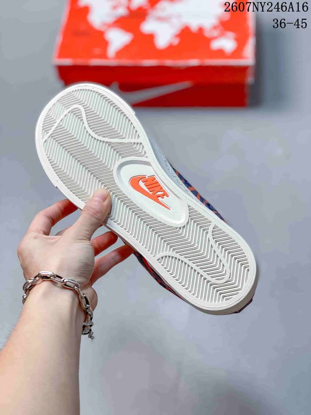 Close-up of the white textured outsole with a Nike logo detail.