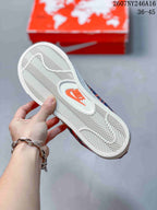 Close-up of the white textured outsole with a Nike logo detail.