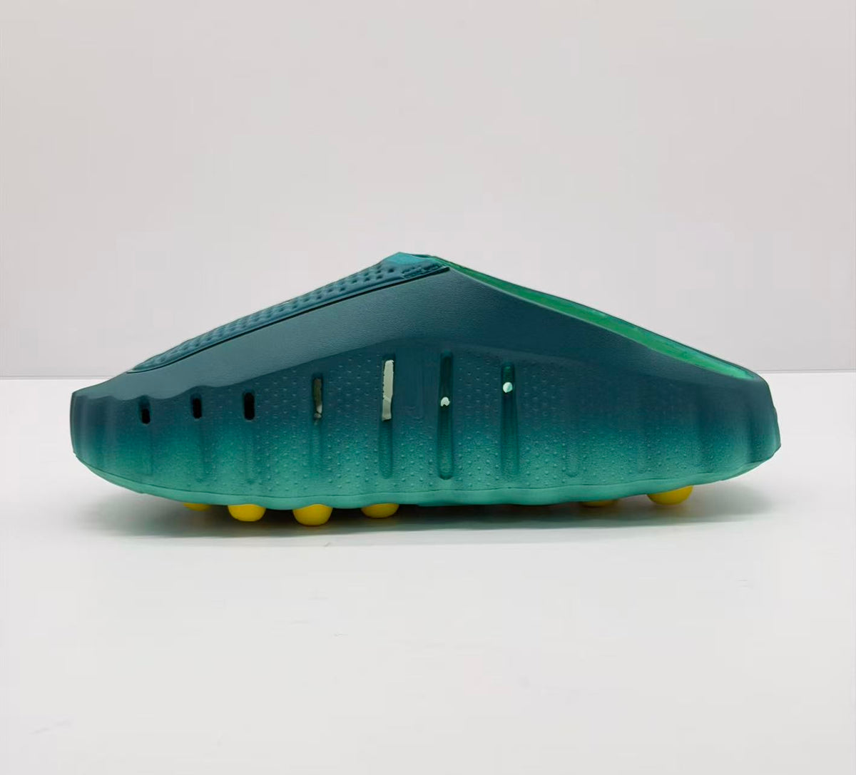 Opposite side view showing ventilation openings and the green molded slide construction.