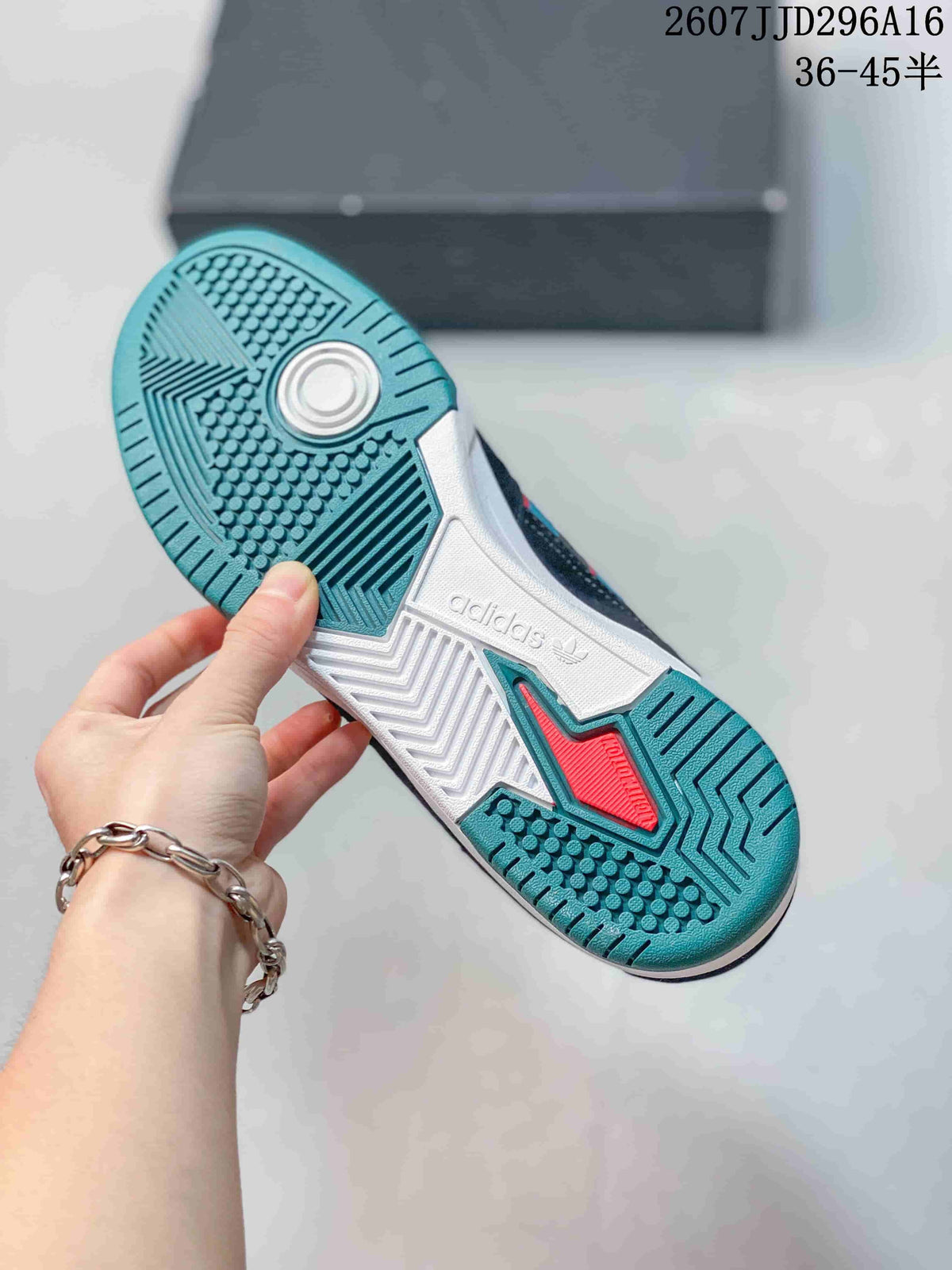 Bottom view showing the teal and white rubber outsole with textured traction patterns.