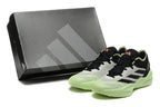 Pale gray Adidas Adizero shoes and a dark shoebox