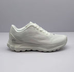 Side view of an all-white Alo low-top sneaker with a textured upper and layered sole.