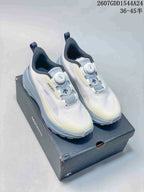Pair of white and light blue DESCENTE LAVITATE WIRE 3.0 running shoes with BOA-style dial closures on a shoe box.