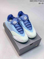 Pair of blue and pale green Jordan Triangle basketball shoes displayed on a Jordan-branded box.