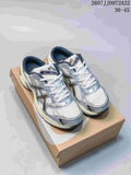 Pair of white and silver ASICS Gel-1130 sneakers displayed on a shoebox; image text shows style code JJD972A22 and size range 36–45.