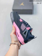 Side view highlighting the black upper, mesh panel, pink midsole accent, and lace system.