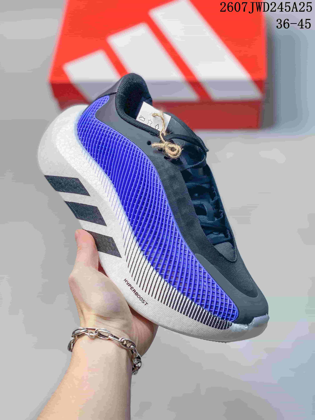 Side view of a single sneaker showing black and purple upper panels, white sole accents and visible HYPERBOOST marking.