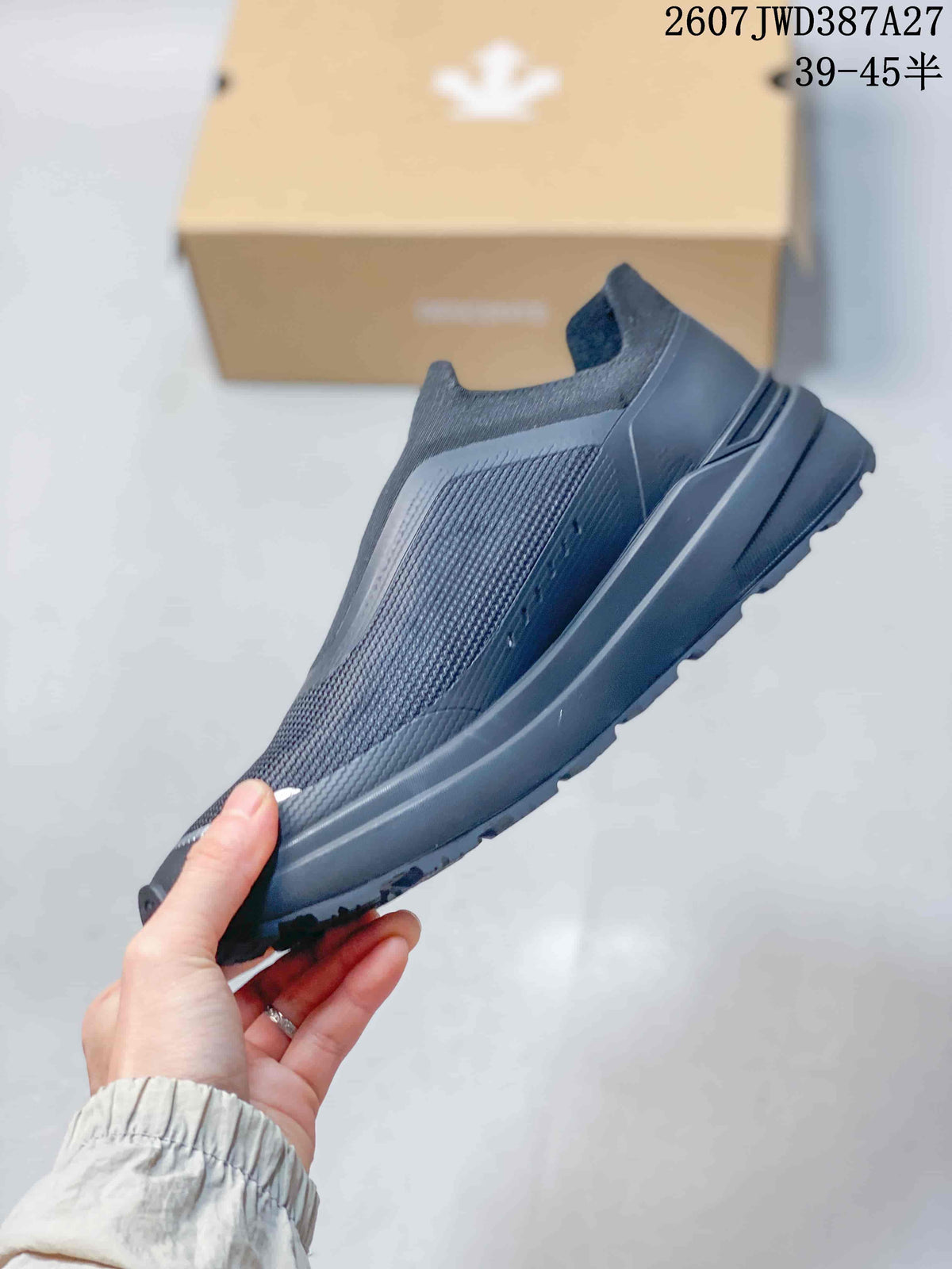 Side view showing the low-top profile, textured upper panel, layered midsole, and outsole tread.