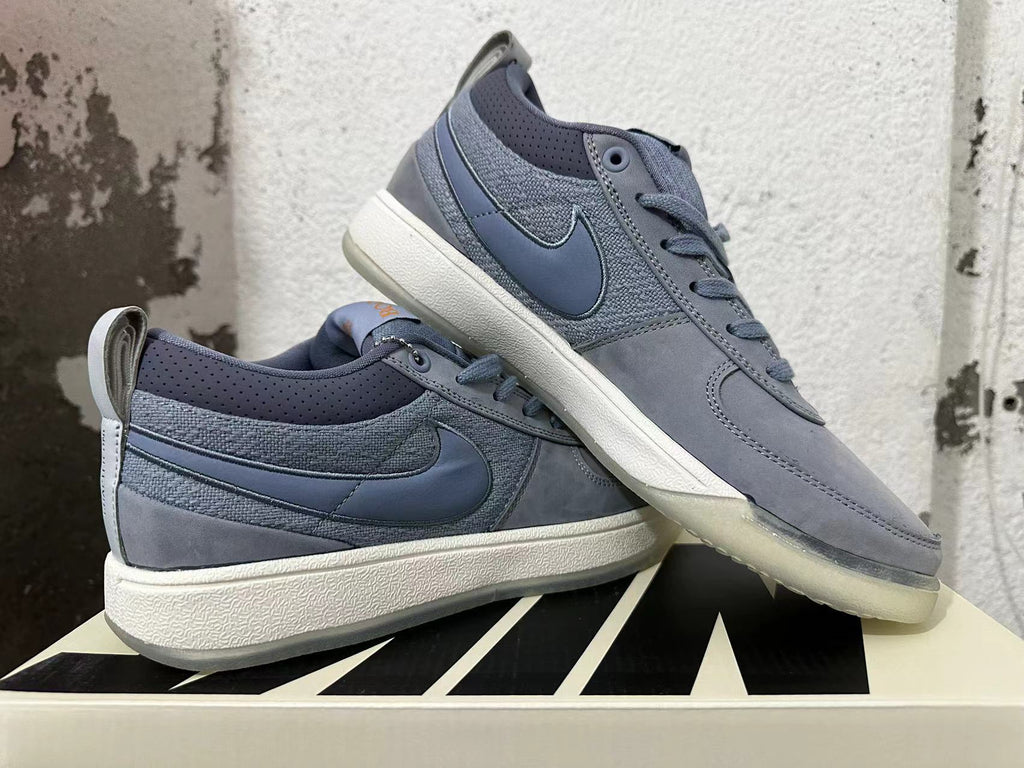 Pair of blue-gray Nike Book 1 shoes displayed from the side