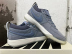 Pair of blue-gray Nike Book 1 shoes displayed from the side