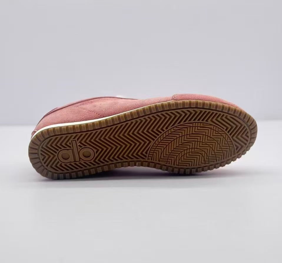 Underside view showing the gum-colored rubber outsole with patterned tread.