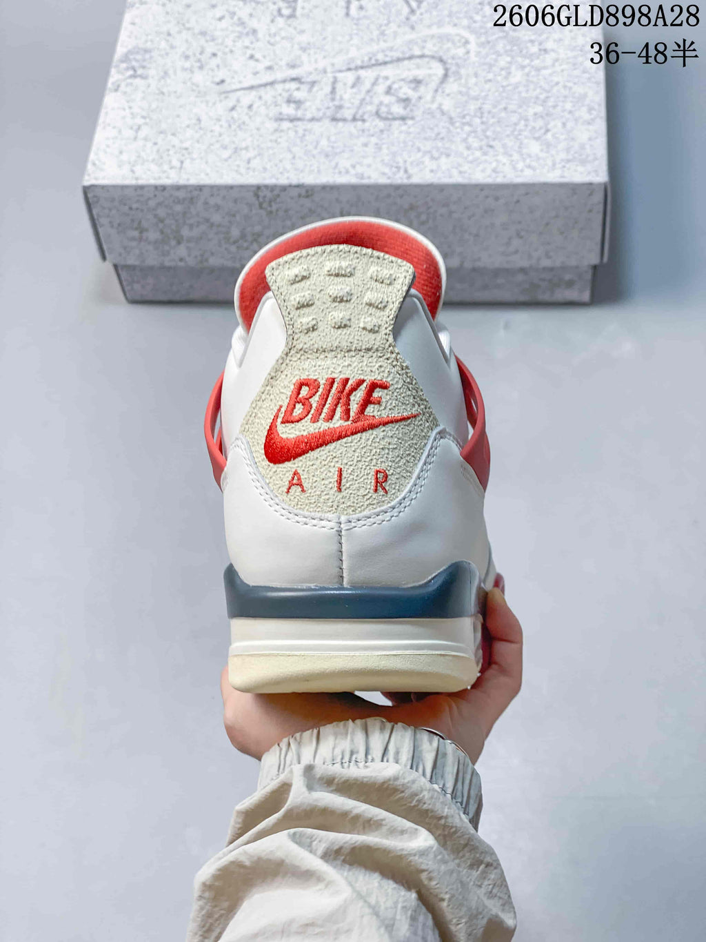 Rear view showing the heel panel and red branding details.